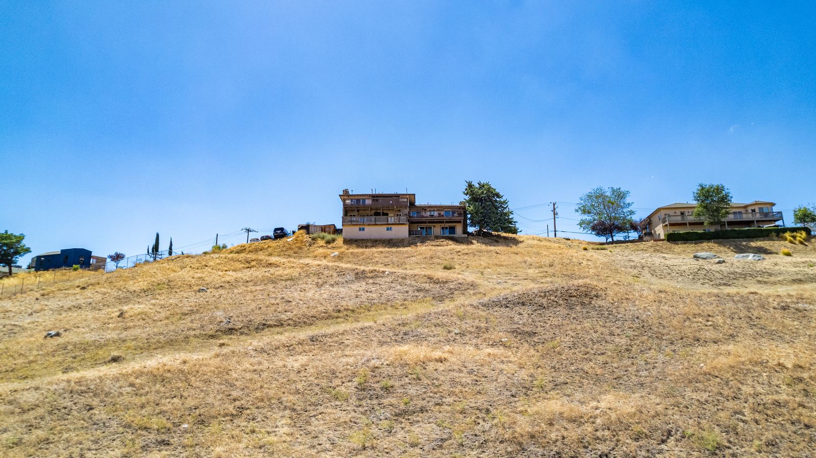 The 2.41-acre hillside parcel rising to the home on the ridgeline